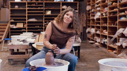 San Diego ceramic artist Savannah Stallings works on the pottery wheel at Tao Of Clay Ceramic studio in Barrio Logan